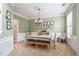 Formal dining room features wainscoting, neutral paint and seating for six at 525 Arbor Creek Ct, Roswell, GA 30076