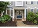 Welcoming front entrance with stone accents and beautifully decorated blue double doors at 525 Arbor Creek Ct, Roswell, GA 30076