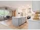 Open kitchen with quartz countertops and dining area is perfect for entertaining at 525 Arbor Creek Ct, Roswell, GA 30076