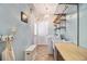 Bright laundry room with washing machine, dryer, sink and exterior access door at 525 Arbor Creek Ct, Roswell, GA 30076