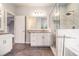 Main bathroom features a glass enclosed shower, vanity, and tub at 525 Arbor Creek Ct, Roswell, GA 30076