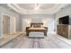Spacious main bedroom with tray ceilings, seating area, and ensuite bathroom at 525 Arbor Creek Ct, Roswell, GA 30076