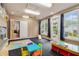 Spacious playroom with large windows, a play area, and direct access to the outdoors at 525 Arbor Creek Ct, Roswell, GA 30076