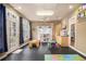 Bright playroom with colorful decor, a play kitchen, and doors leading to the backyard at 525 Arbor Creek Ct, Roswell, GA 30076