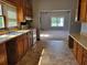 Functional kitchen with plenty of cabinet space and an adjoining living area at 7217 Union Grove Rd, Lithonia, GA 30058