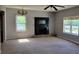 Bright living room featuring a decorative fireplace and ample natural light at 7217 Union Grove Rd, Lithonia, GA 30058