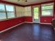 Bright and sunny sunroom with hardwood floors and multiple windows at 7217 Union Grove Rd, Lithonia, GA 30058