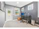 Bedroom featuring a desk area with natural light and a door to the backyard at 160 Amherst Way, Fayetteville, GA 30215
