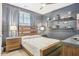 Serene bedroom showcasing a wooden bed frame, stylish bedside tables, and decorative wall shelves at 160 Amherst Way, Fayetteville, GA 30215