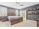 Spacious bedroom with wooden accents, featuring two windows and decorative shelves on the wall at 160 Amherst Way, Fayetteville, GA 30215