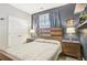 Comfortable bedroom featuring a wooden bed frame, stylish bedside tables, and decorative wall shelves at 160 Amherst Way, Fayetteville, GA 30215