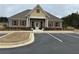 Attractive clubhouse features a brick facade, well-maintained landscaping and convenient parking at 160 Amherst Way, Fayetteville, GA 30215