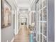 Hallway features hardwood floors, decorative accents, and an open view to the living spaces at 160 Amherst Way, Fayetteville, GA 30215