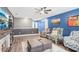 Spacious living room featuring a stone fireplace, comfortable seating, and modern finishes at 160 Amherst Way, Fayetteville, GA 30215