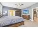 Large main bedroom with a comfortable bed, dresser, and an entertainment center with a TV at 160 Amherst Way, Fayetteville, GA 30215