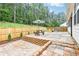 Beautiful backyard patio with brick pavers, perfect for outdoor entertaining and relaxation at 160 Amherst Way, Fayetteville, GA 30215