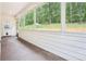 Enclosed porch with views of the backyard and a door to the backyard at 160 Amherst Way, Fayetteville, GA 30215