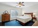 Primary bedroom with hardwood floors, a ceiling fan, and natural light from a window at 3585 Roxboro Ne Rd # 2, Atlanta, GA 30326