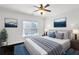 Comfortable bedroom with soft colors, a ceiling fan, and natural light, creating a serene atmosphere at 3585 Roxboro Ne Rd # 2, Atlanta, GA 30326