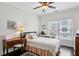 Cozy bedroom with a ceiling fan, a plush bed, and a sunny window with blinds at 3585 Roxboro Ne Rd # 2, Atlanta, GA 30326