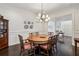 Formal dining room showcasing hardwood floors, white wainscoting, classic wooden furniture, and stylish decor at 3585 Roxboro Ne Rd # 2, Atlanta, GA 30326