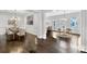 Open dining and kitchen area featuring dark hardwood floors and a large table at 3585 Roxboro Ne Rd # 2, Atlanta, GA 30326