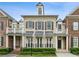 Charming brick townhome featuring black shutters and a manicured front yard at 3585 Roxboro Ne Rd # 2, Atlanta, GA 30326