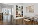 Bright foyer with a built-in bookcase and hardwood floors leading into a dining room at 3585 Roxboro Ne Rd # 2, Atlanta, GA 30326