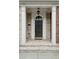 Elegant front door with white trim, brick steps, and classic overhead lighting at 3585 Roxboro Ne Rd # 2, Atlanta, GA 30326