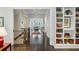 Hallway with hardwood floors, staircase, and custom built-in bookshelves at 3585 Roxboro Ne Rd # 2, Atlanta, GA 30326