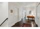 Bright hallway featuring hardwood floors, white walls, and elegant trim detail at 3585 Roxboro Ne Rd # 2, Atlanta, GA 30326