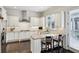 Well-equipped kitchen with white cabinets, stainless appliances, granite countertops, hardwood floors, and breakfast bar at 3585 Roxboro Ne Rd # 2, Atlanta, GA 30326