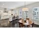 Bright eat-in kitchen featuring white cabinets, stainless steel appliances, and granite countertops at 3585 Roxboro Ne Rd # 2, Atlanta, GA 30326