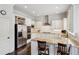 Well-lit kitchen featuring granite countertops, stainless steel appliances, white cabinetry, and hardwood flooring at 3585 Roxboro Ne Rd # 2, Atlanta, GA 30326