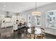 Bright kitchen with white cabinetry, stainless steel appliances, and an eat-in island at 3585 Roxboro Ne Rd # 2, Atlanta, GA 30326