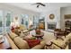 Well-lit living room with fireplace, ceiling fan, and access to outdoor patio at 3585 Roxboro Ne Rd # 2, Atlanta, GA 30326