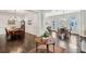 Open-concept living and dining areas featuring hardwood floors, white walls, and abundant natural light at 3585 Roxboro Ne Rd # 2, Atlanta, GA 30326