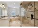 Elegant main bathroom with dual vanities, luxurious soaking tub, and glass-enclosed shower at 3585 Roxboro Ne Rd # 2, Atlanta, GA 30326