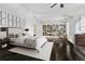 Spacious main bedroom with a tray ceiling, natural light, and built in bookshelves at 3585 Roxboro Ne Rd # 2, Atlanta, GA 30326