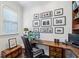 Comfortable home office with wooden desk, leather chair, picture wall, and natural light at 3585 Roxboro Ne Rd # 2, Atlanta, GA 30326