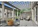 Relaxing outdoor patio area with pergola, complete with seating and potted plants on a sunny day at 3585 Roxboro Ne Rd # 2, Atlanta, GA 30326