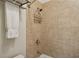 Tiled shower with adjustable shower head and a convenient corner caddy at 3585 Roxboro Ne Rd # 2, Atlanta, GA 30326