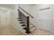 Carpeted staircase with wooden railings and decorative metal spindles at 3585 Roxboro Ne Rd # 2, Atlanta, GA 30326