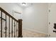 Staircase with carpeted steps, wooden railings, and decorative metal spindles at 3585 Roxboro Ne Rd # 2, Atlanta, GA 30326