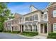 Charming row of brick townhomes with manicured landscaping and awnings at 3585 Roxboro Ne Rd # 2, Atlanta, GA 30326