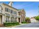 Brick townhomes featuring manicured landscaping, awnings and black window shutters at 3585 Roxboro Ne Rd # 2, Atlanta, GA 30326