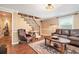 Finished basement living area with stairs, tile floors, and leather furniture at 733 Huntington Se Pl, Marietta, GA 30067