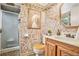 Bathroom featuring mosaic tile walls, glass shower, and wooden vanity with sink at 733 Huntington Se Pl, Marietta, GA 30067
