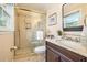 Bathroom featuring a glass shower, marble countertop vanity, toilet and tile floor at 733 Huntington Se Pl, Marietta, GA 30067
