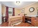 Comfortable bedroom featuring wood floors, stylish decor, and a cozy atmosphere at 733 Huntington Se Pl, Marietta, GA 30067